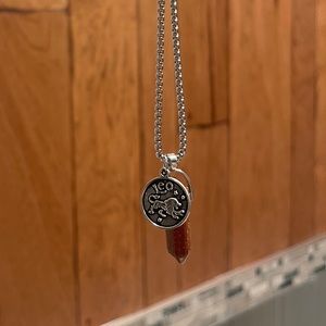 Leo zodiac crystal stone pendant and necklace. Maroon sprinkle crystal